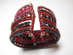 "Really cool vintage cuff, made of beads and wire,shades do reds and pink with silver.measures 8\" around and 1.5\" thick. From the 70-80s very boho." Bohemian Red Cuff Bracelet As Gift, Red Metal Bohemian Bangle, Red Adjustable Vintage Cuff Bracelet, Red Bohemian Hand-strung Jewelry, Red Bohemian Nickel-free Bracelets, Red Jewelry, Red Bead, Pink Bracelet, Boho Bracelets