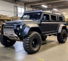 an suv is parked in a large warehouse