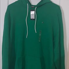 Green Tommy Hilfiger Hoody Casual Green Tommy Hilfiger Tops, Tommy Hilfiger Long Sleeve Hooded Top, Tommy Hilfiger Casual Tops With Drawstring Hood, Casual Tommy Hilfiger Tops With Drawstring Hood, Tommy Hilfiger Casual Hoodie Top, Casual Tommy Hilfiger Hoodie Top, Casual Tommy Hilfiger Hoodie, Casual Hooded Top By Tommy Hilfiger, Tommy Hilfiger Casual Hoodie Sweatshirt