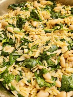 pasta with spinach and white beans in a pan