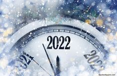 a clock with the numbers 2012 on it in front of snow and christmas tree branches