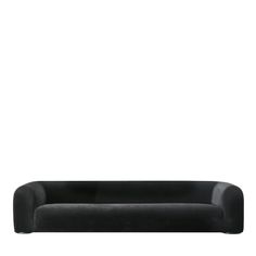 a black couch sitting on top of a white floor