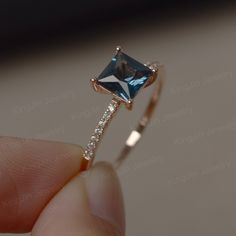 This is a gorgeous handmade creation. Its beauty is its simplicity & Elegance. The 6*6mm princess cut London blue topaz is crafted in solid 14k gold. It is available to customized, if you have any mind, just let me know, we will discuss with it. All item is sent in a beautiful gift box You can realize more lovely stuff clicking the link https://www.etsy.com/shop/knightjewelry?refshopsection_shophome_leftnav Please leave the correct address and you PHONE NUMBER for delivering successfully. Elegant Square Cut Topaz Promise Ring, Elegant Princess Cut Sapphire Promise Ring, Elegant Solitaire Princess Cut Topaz Ring, Elegant Princess Cut Solitaire Topaz Ring, Elegant Princess Cut Topaz Ring With Diamond, Elegant Princess Cut Diamond Topaz Ring, Elegant Princess Cut Topaz Ring, Elegant Square Cut Topaz Ring With Prong Setting, Elegant Square Cut Topaz Ring Gift