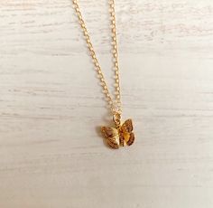 "BRENNAN   necklace features a dainty gold plated gold butterfly charm.   This is a shiny finish.  The chain is roughly 16\" long.   If you would like an extesion please see our listing to purchase extra length.   The chain is gold filled.  This is a beautiful lightweight piece.   The charm is roughly 1/4\". It's about the size of a dime.  It will come on a Haven jewelry card wrapped in a white  jewelry box with a bow. Perfect for gift giving. Follow Us on Social Media: https://www.instagram.com/havencurated/ https://m.facebook.com/havencurated/" Everyday Gold Butterfly-shaped Jewelry, Dainty Adjustable Gold Butterfly Necklace, Everyday Gold Necklace With Butterfly Charm, Gold Butterfly Charm Pendant Necklace, Gold Butterfly Charm Necklace With Delicate Chain, Gold Charm Necklace With Butterfly For Everyday, Nickel Free Gold Butterfly Necklace, Gold Butterfly Necklace For Everyday Wear, Gold Nickel-free Butterfly Necklace