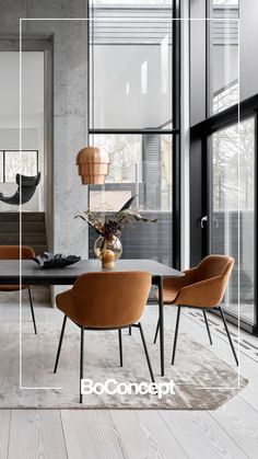 an elegant dining room with modern furniture and large windows