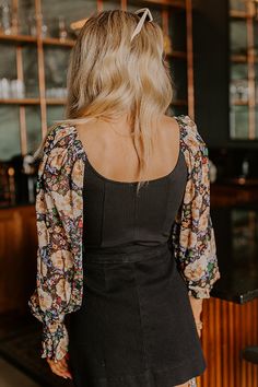 - Elevate your OOTD with a fabulous pop of floral with this gorgeous bodysuit! Its flattering silhouette and sheer floral sleeves make it perfect for a chic look. Step into effortless style with this beautiful piece! - Stretchy ribbed material as well as sheer floral chiffon material at the sleeves featuring cream, neutral, red, green, blue hues - A scoop cut neckline and back - Long sleeves with elastic shoulders and smocked ruffle cuffs - A flattering silhouette that ends in cheeky cut bottoms Floral Sleeves, Concert Fashion, Floral Bodysuit, Essential Dress, Sweater Jumpsuit, Floral Sleeve, Chiffon Material, Curve Dresses, Floral Chiffon