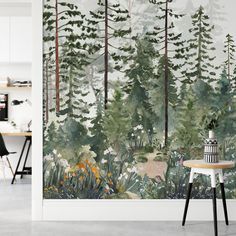 a wall mural with trees and flowers in the foreground, along with a table on the other side