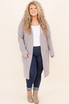 This cardigan was made for cuddle weather! It has a solid neutral color you can style for every occasion! It's comfortable for all day wear, has a figure-flattering fit, and even features pockets! Simply pair this cardigan with a patterned top or basic dress for an easy everyday look! 90% Polyester, 5% Rayon, 5% Spandex Made in the USA. Gray Fall Cardigan For Everyday, Gray Fall Cardigan For Everyday Wear, Cozy Everyday Cardigan With Pockets, Gray Cardigan For Everyday Fall Wear, Cozy Fit Soft Knit Everyday Cardigan, Comfortable Fall Everyday Cardigan, Comfortable Everyday Fall Cardigan, Gray Soft Knit Cardigan For Everyday, Gray Soft Knit Everyday Cardigan