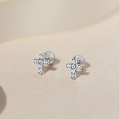 These delicate cross earrings for little girls are timeless and elegant, making them the perfect for that little one in your life. Full of quality cubic zirconia stones, these hypoallergenic cross earrings are crafted in 925 sterling silver and are safe for children with sensitive ears. The posts are threaded and feature a safety back system to ensure your child's earrings stay comfortably in place. These earrings make a great gift for the Christian child in your life. A complimentary gift box i Diamond Cross Earrings For Gift, Diamond Cross Earrings As Gift, Christian Kids, Kids Earrings, Cross Earrings, Sensitive Ears, Girls Shopping, Sterling Silver Earrings, Screw