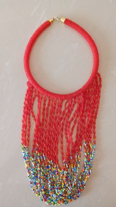 African Fringe Necklace, African Beaded Jewelry, Red Beaded Necklace, Tribal Jewelry, Women Necklaces, Mothers Gift, Chunky Jewelry This multi strand necklace is superbly crafted which makes you out stand in any occasion. Main Color - Red. Different colors are available. Feel free to send me a convo or e-mail for any clarification or more information. Thank you for visiting, Red Polished Beads Necklace For Party, Red Beaded Necklaces For Party With Polished Beads, Red Dangling Beads For Party, Traditional Red Necklace With Tiny Beads, Party Red Polished Beaded Necklaces, Red Round Beads Choker For Festivals, Red Dangling Beads Necklace For Festivals, Red Beaded Chain For Festivals, Bohemian Red Choker With Colorful Beads