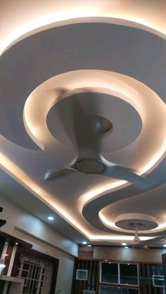 the ceiling is decorated with white lights and circular shapes