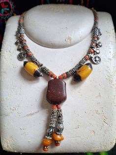 Unique Silver Beads Pendant Jewelry, Unique Silver Beaded Pendant Jewelry, Unique Ceremonial Jewelry With Silver Beads, Artisan Silver Necklace For Rituals, Handmade Amulet Necklaces For Festivals, Handmade Amulet Necklace For Festivals, Bohemian Amber Jewelry With Silver Beads, Amber Jewelry With Silver Beads As A Gift, Amber Jewelry With Silver Beads For Gift