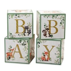 three wooden blocks with woodland animals on them and the letters b, c, y