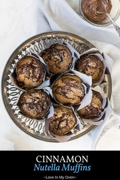 cinnamon nutella muffins on a plate with chocolate frosting