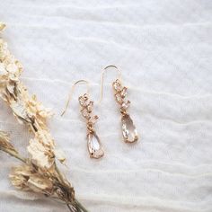 Effortlessly elegant, our floral CZ dangles are designed with marquis shaped CZ stones that descend into a teardrop shaped crystal. Whether you're a bride, wedding guest, or celebrating something special, these will give you a stunning look that will turn heads. Our most popular choice for brides and bridal parties. THE DETAILS -Earrings are finished with 14K gold filled hooks, cubic zirconia stones, and include soft rubber backings -Shipped via USPS with tracking *Please contact us via hello@ka Bridal Parties, Pop Up Event, Forest Wedding, Gold Sparkle, Bride Wedding, Soft Rubber, Cz Stone, Something Special, Wedding Guest