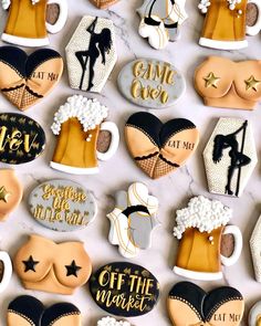 decorated cookies are arranged in the shape of beer mugs and mittens with words on them