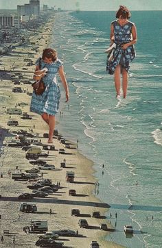 two girls are walking along the beach with cars parked on the shore and in the water