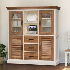 a wooden cabinet with shutters on the front and doors open to reveal a coffee maker