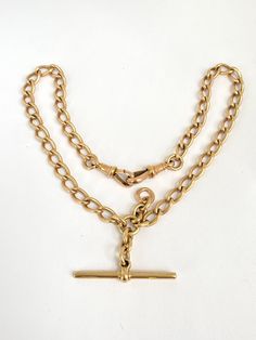 This is an absolutely superb Victorian Albert chain. Crafted from 31.43g of solid 9ct gold, it remains in exquisite condition - quite remarkable give its age and history.  It comes with a gorgeous T bar, with its makers mark J. M, and two solid dog clips. These, along with every smooth link, are all clearly hallmarked for 9ct Gold.  Its jump ring is marked for Birmingham and the Edwardian year 1901.  Weighing a comfortable 31.43g, this chain is substantial yet elegant, and has an enviable choker Formal Yellow Gold Chain Necklace With Gold Clasp, Victorian Gold Jewelry With Hooks And Links, Formal Engraved Link Chain Necklace, Historical Yellow Gold Jewelry For Ceremonial Use, Historical Yellow Gold Jewelry For Ceremonies, Historical Yellow Gold Jewelry For Ceremonial Occasions, Historical Ceremonial Yellow Gold Jewelry, Antique Oval Link Chain Necklace, Antique Curb Chain Necklace