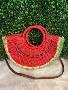 Adorable straw watermelon bag with a brown strap Cute Summer Bag With Adjustable Strap, Summer Green Handheld Straw Bag, Summer Bags With Bamboo Handle For Picnic, Green Vacation Bags With Bamboo Handle, Green Vacation Bag With Bamboo Handle, Handmade Summer Picnic Bag, Handmade Summer Picnic Bags, Cute Summer Shoulder Bag With Adjustable Strap, Adjustable Woven Summer Bags