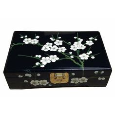 a black box with white flowers painted on it