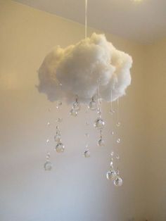 a white cloud hanging from the ceiling in a room