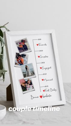 a white frame with photos and hearts on it sitting next to a potted plant