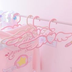 pink clothes hangers with cartoon characters on them