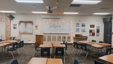 an empty classroom with desks and chairs