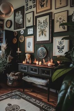 a living room filled with lots of pictures on the wall and candles in front of them