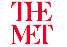 the met logo is red on white paper