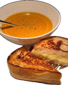 grilled cheese and tomato soup in a white bowl