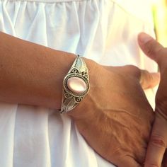 This is a beautiful vintage sterling silver and light pink mother of pearl open cuff Native American style bracelet. It is marked Sterling L. Spencer .925. The bracelet has an excellently looking construction. The pink mother of pearl is oval shaped and is about 3/4" tall by about 5/8" wide. The leaves, filigree and overall design make it beautiful and strong. The serrated bezel ring around the stone is tall enough to hold the stone solidly.   This  bracelet is in great pre-owned vintage condition It is built as a small to medium. The opening is about 1 1/8" wide where you slip you wrist through and the inside diameter is about 2 1/4" at its widest points.   This is a very nice gift or get it for yourself. More jewelry in my shop https://www.etsy.com/shop/AGardenCottage?ref=seller-platform Bohemian Stamped 925 Bracelet Gift, Bohemian Sterling Silver Bracelet As Gift, Bohemian Style Oyster Bracelet, Elegant Adjustable Pink Sterling Silver Bracelet, Bohemian Sterling Silver Cuff Bracelet For Weddings, Bohemian Sterling Silver Wedding Cuff Bracelet, Vintage Sterling Silver Bracelet Stamped 925, Elegant Stamped 925 Cuff Bracelet, Bohemian Nickel-free Pink Jewelry