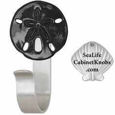 an image of a blue sand dollar on a metal hook with the sealife cabinet knobs com logo below it