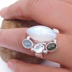 Natural Rainbow Moonstone Ring, Multi Stone Cluster Ring, Chunky Style Ring, Handmade Silver Gemstone Rings, Stunning Silver Ring.Product:- RingModal no:- U392Metal:- 925 Sterling SilverGemstone :- Multi stoneGemstone size:- 10x20 5x7 mmFinishing:- Shiny silverWe are using Pure 925 (Stamped) Sterling Silver with Natural Gemstone Jewelry, all of our jewelry designs are Handmade.We are adding new creative designs in our store regularly, for new handmade stuff please get touch with our store.We alw Unique White Multi-stone Moonstone Ring, White Multi-stone Moonstone Ring, Adjustable Multi-stone Moonstone Ring Gift, White Sterling Silver Rings With Stones, Unique White Rings With Stones, Unique White Moonstone Gemstone Ring, White Sterling Silver Gemstone Ring, Sterling Silver Multi-stone Moonstone Ring, Sterling Silver Moonstone Ring With Stones