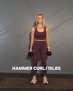 a woman is standing in front of a wall with the words hammer curl / 15lbs