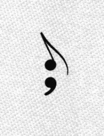 a black and white photo of a musical note