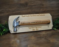 a wooden plaque with a hammer on it that says retirement - a time to build memories