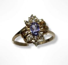 ⚓14k Yellow Gold Tanzanite Diamond Cluster Ring ( 7.25 ) Solid 14K gold, stamped 14K. Not filled or plated. In excellent condition! We sell the highest quality vintage and pre-owned items. Free domestic shipping always! On its way to you in 1 business day.  30 day return policy!  ⚓The Details Size 7.25 1 oval Tanzanite 16 round diamonds 3.1 grams ⚓Who We Are  We are a small, family-owned business in Plymouth, MA. Located in the heart of Main Street, Main Street Jewelry Co.'s mission is to find o Vintage Gold Cluster Ring With Gemstones, Vintage Multi-stone Gold Ring, Vintage Gold Multi-stone Cluster Ring, Vintage Gold Multi-stone Ring, Estate Gold Ring As Gift, Formal Gold Multi-stone Rings, Vintage Gold Sapphire Ring Stamped 14k, Vintage Gold Sapphire Ring For Anniversary, Gold Multi-stone Amethyst Ring For Formal Occasions