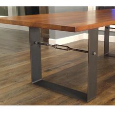 a wooden table sitting on top of a hard wood floor