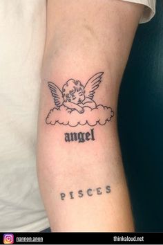 an angel tattoo on the arm that reads angel pisces and has a cloud with a cherub above it