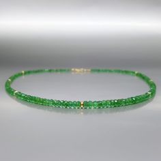 Fine precious green Colombian Emerald necklace with solid 14k gold. Unique gift for her, girlfriend, wife, May birthstone, 20 and 35 year anniversary. Extraordinary green beads of Emerald, faceted to perfection in many small faces, sparkling and shining with an elegance. The necklace is enhanced with tiny 14K gold beads. All our stones are natural stones and our jewelry is handmade, slight differences in color and size may occur. The stones are strung on stainless steel for maximum hold and fini Elegant Green Briolette Gemstones, Green Polished Beads Necklace For May Birthstone, Rondelle Emerald Necklace For Gift, Green Emerald Beaded Necklace As Gift, Green Beaded Jewelry For Anniversary, Emerald Necklace With Faceted Beads For Gift, Emerald Necklace With Faceted Green Onyx Beads As Gift, Faceted Yellow Gold Necklaces For May Birthstone, Gift Emerald Necklace With Faceted Green Onyx Beads