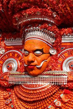 an elaborately decorated mask is displayed on display