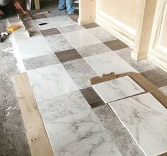 the floor is being laid out for tile work on it's walls and floors