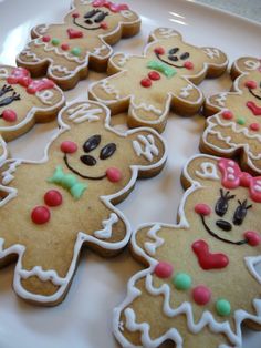 some decorated cookies on a white plate