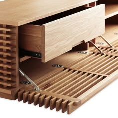 a wooden desk with drawers that are open to reveal the bottom part of the table