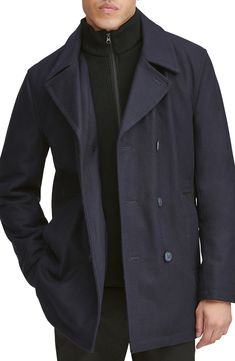 A hearty wool blend enriches a classic peacoat with a smart internal bib for added warmth and protection. 33" length Double-breasted button closure Notched lapels Side welt pockets Lined, with 100% polyester fill 46% wool, 40% polyester, 5% acrylic, 4% nylon, 3% rayon, 2% cotton Dry clean Imported Men's Clothing Winter Navy Double-breasted Blazer, Winter Navy Blazer With Double-breasted Buttons, Navy Double-breasted Blazer For Winter, Double-breasted Winter Peacoat For Business, Winter Business Double-breasted Peacoat, Business Winter Double-breasted Peacoat, Business Peacoat With Double Button Closure And Long Sleeves, Business Long Sleeve Peacoat With Double Button Closure, Navy Wool Blazer With Button Closure