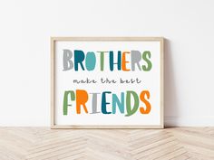 a wooden frame with the words brothers make the best friends in multicolored letters