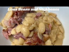 a white plate topped with beans and meat