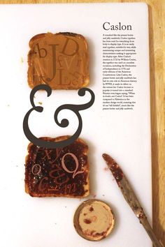 a piece of bread sitting on top of a white cutting board next to a knife